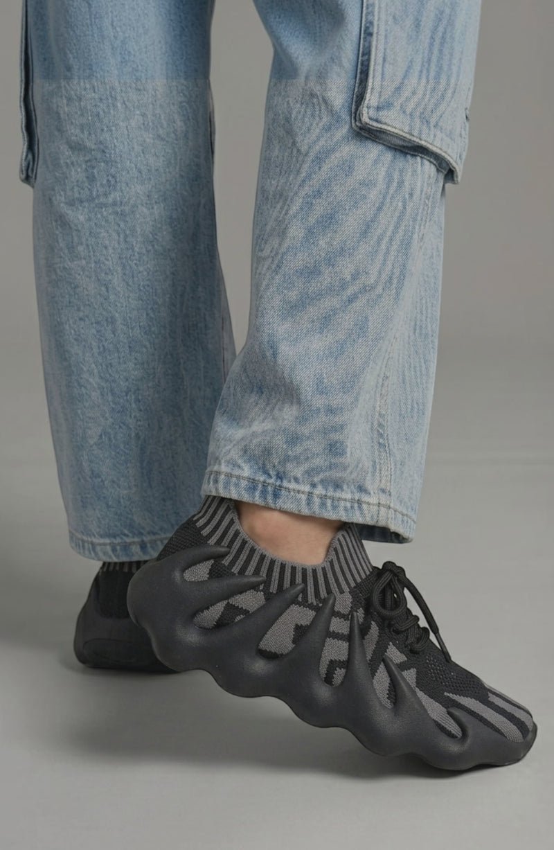 LORVENES Midnight Muse sneakers in black with white soles, featuring stylish laces and modern athletic design.