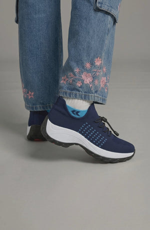 LORVENE Calm Glow sneakers in soft pastel colors, featuring a sleek design and comfortable fit, shown from the top right angle.