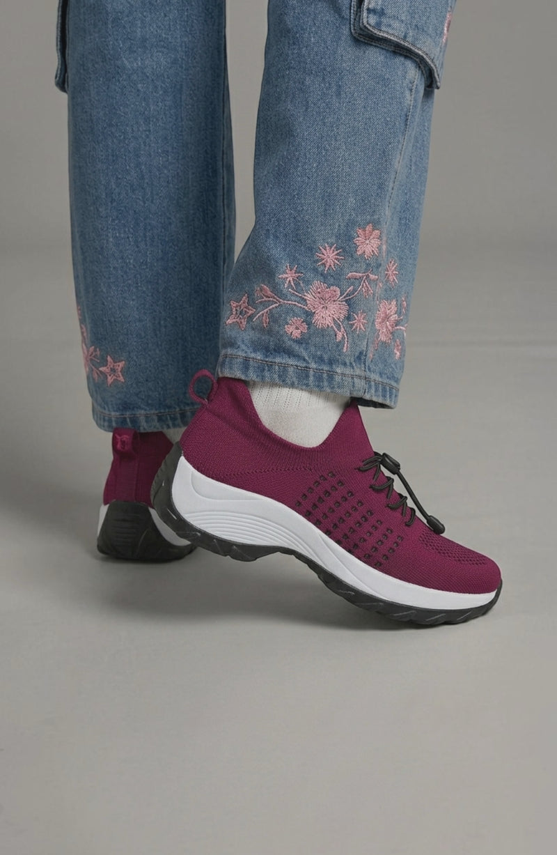 LORVENE Calm Glow sneakers featuring a sleek design, white and pastel accents, and comfortable athletic style.
