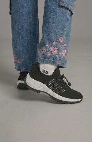 LORVENE Calm Glow sneakers featuring a sleek design, white and pastel accents, and comfortable athletic shoe style.