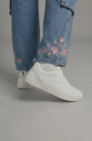LORVENE Glide Flare Sneakers in white with stylish flare sole and lace-up design, displayed on a neutral background.