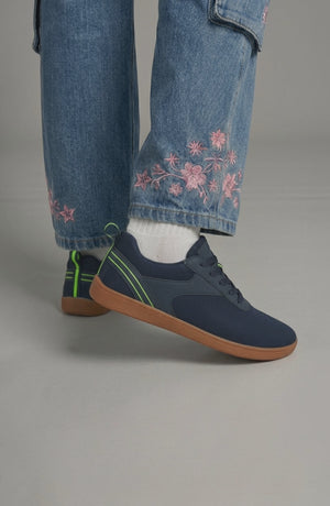 LORVENE Glide Flare Sneakers in white with chunky soles, featuring stylish laces and a modern athletic design.