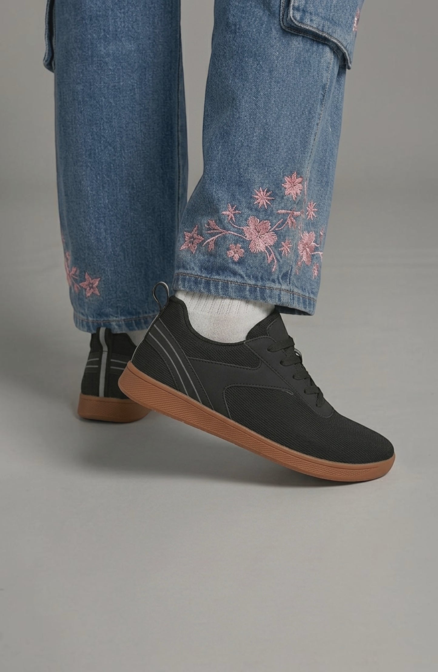 LORVENE Glide Flare Sneakers showing white canvas upper, white rubber sole, and lace-up design with stylish flare details.