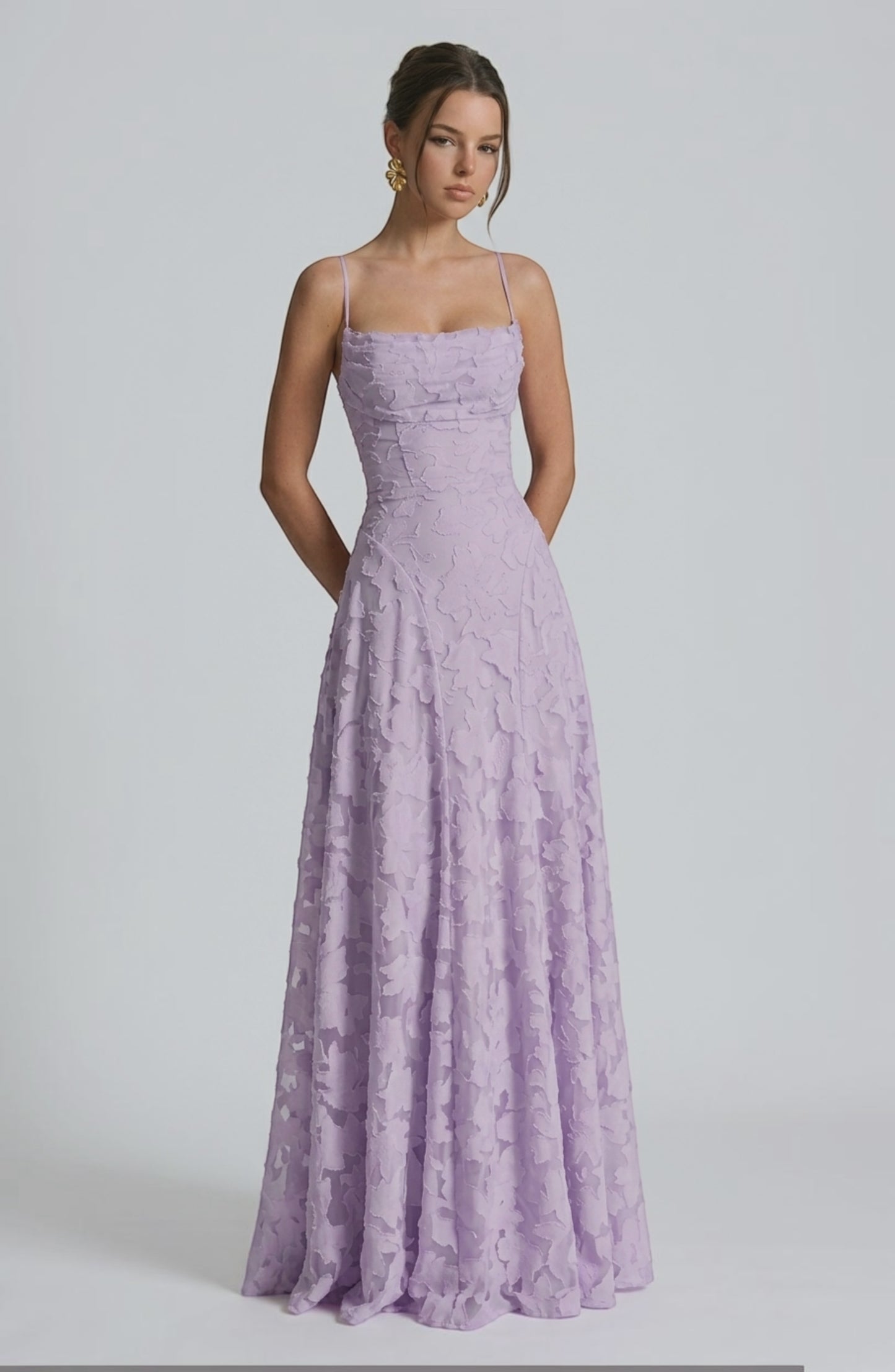Elegant flowy bridal dress by LORVENES featuring delicate fabric and intricate design, perfect for a wedding or special occasion.