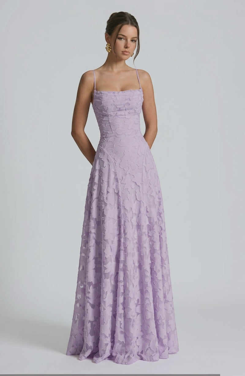 Elegant flowy bridal dress by LORVENES featuring delicate fabric and intricate design, perfect for a wedding or special occasion.