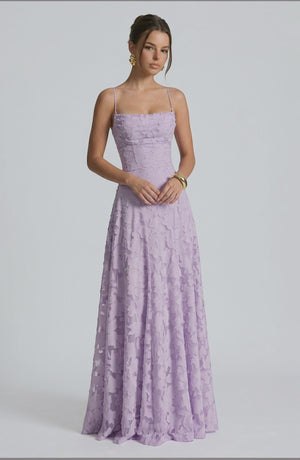 Elegant flowy bridal dress by LORVENES featuring delicate fabric and a graceful silhouette, perfect for a wedding ceremony.