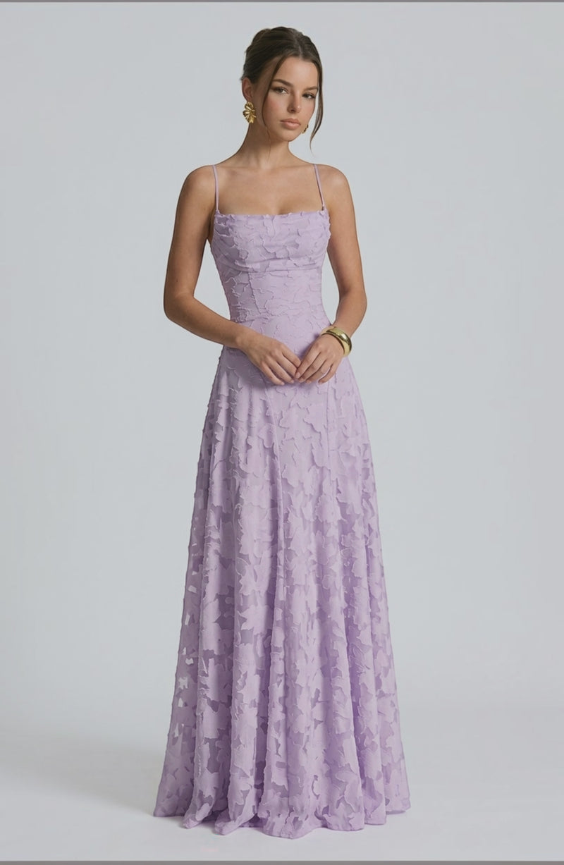Elegant flowy bridal dress by LORVENES featuring delicate fabric and a graceful silhouette, perfect for a wedding ceremony.