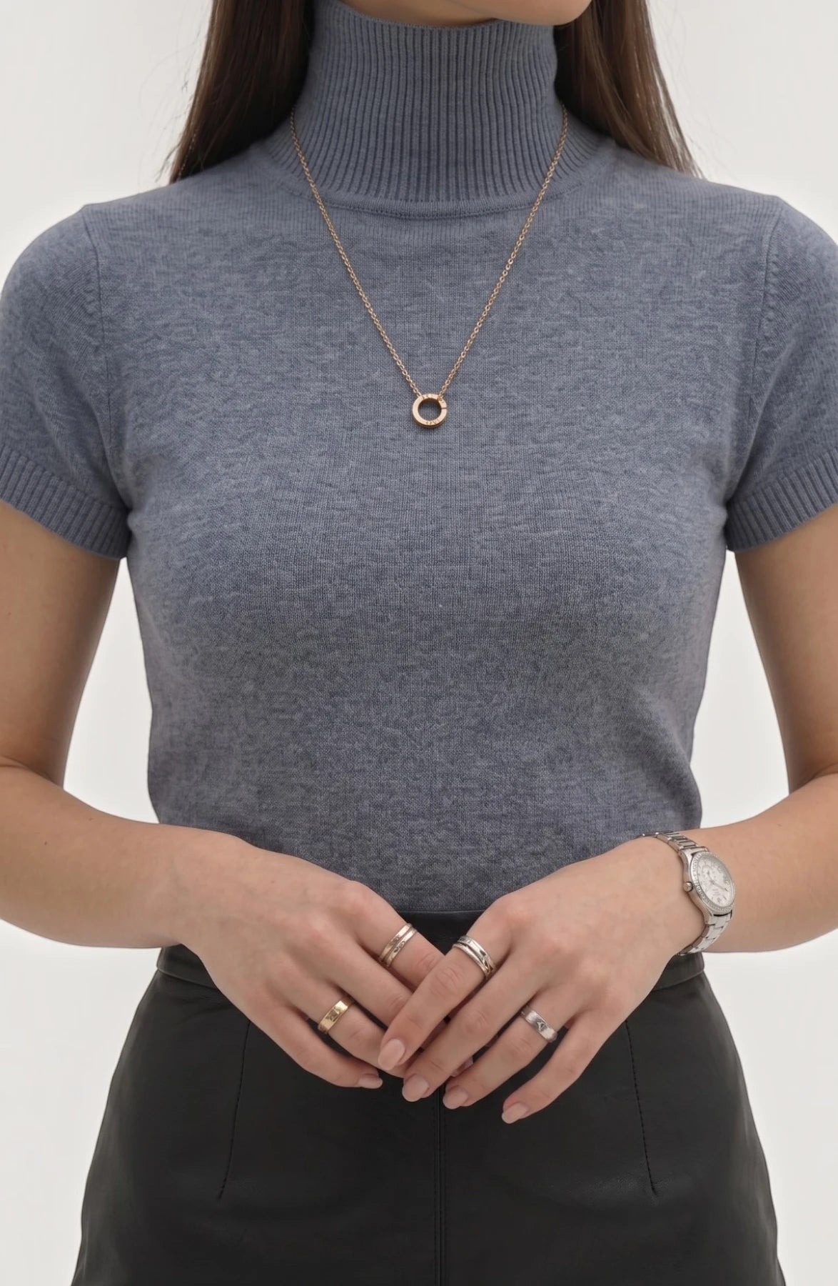 LORVENE Pure Poly Blend High Neck top in neutral color, close-up of fabric and high neckline style.