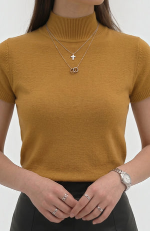 LORVENE Pure Poly Blend High Neck top featuring a fitted silhouette and high neckline, shown in a close-up image.