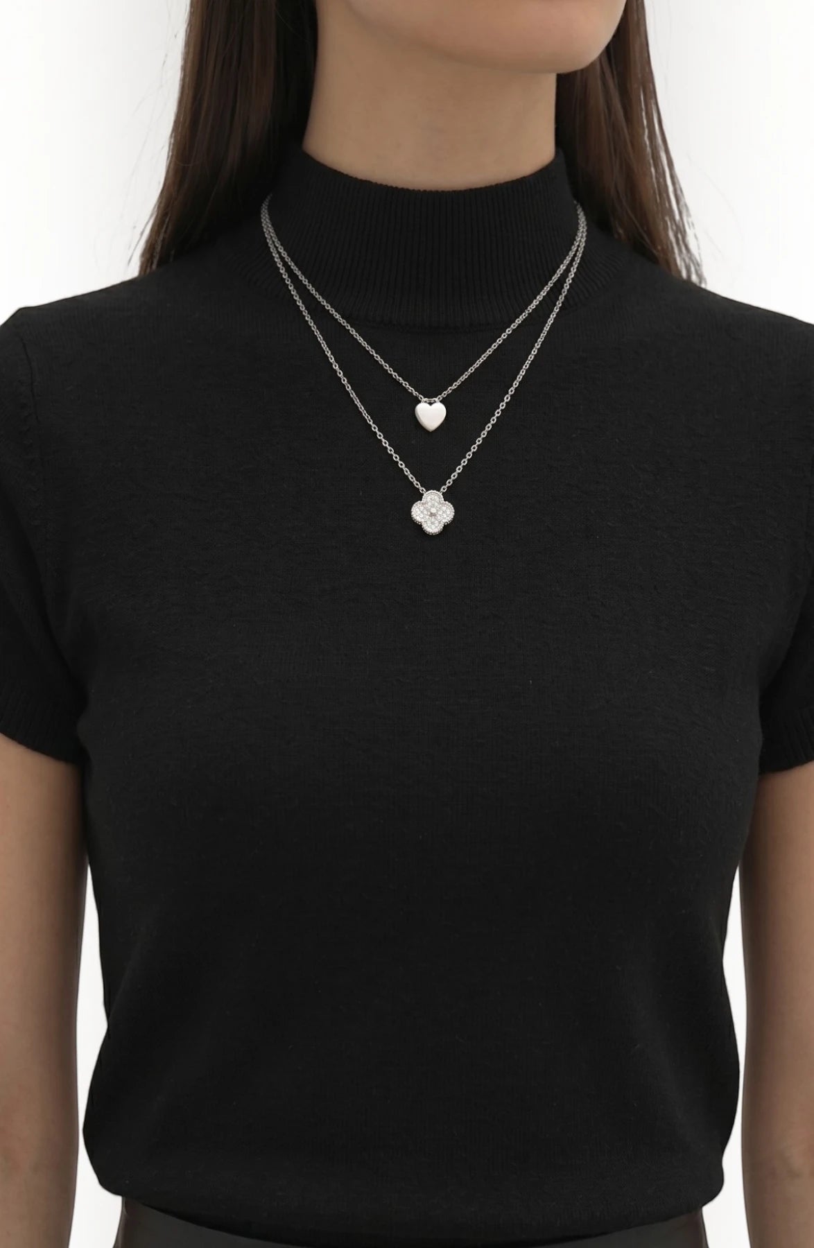 LORVENE pure poly blend high neck sweater, shown in a close-up of the ribbed neckline and soft fabric texture.