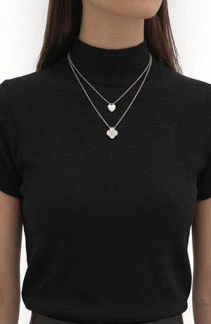 LORVENE pure poly blend high neck sweater, shown in a close-up of the ribbed neckline and soft fabric texture.