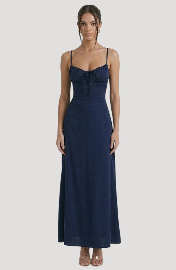 LORVENE Pure Ruffle Maxi dress featuring flowing fabric and ruffled details, displayed on a model in a stylish pose