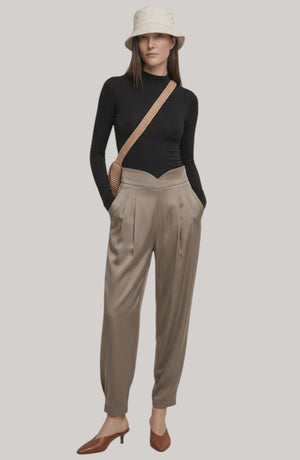 LORVENE Line Edge Pants showcased from the top left pose, highlighting the sleek design and fabric texture of the stylish pants.