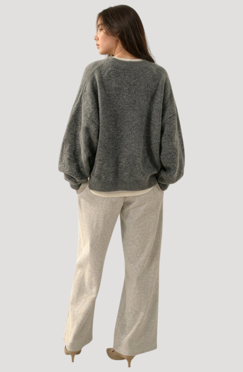 LORVENES Everyday Oversized Sweater in neutral color, featuring a cozy knit fabric and relaxed fit, shown from the top right angle.