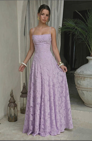 Model wearing LORVENES sexy flowy bridal dress in soft fabric with elegant draping and a fitted bodice, ideal for wedding occasions.