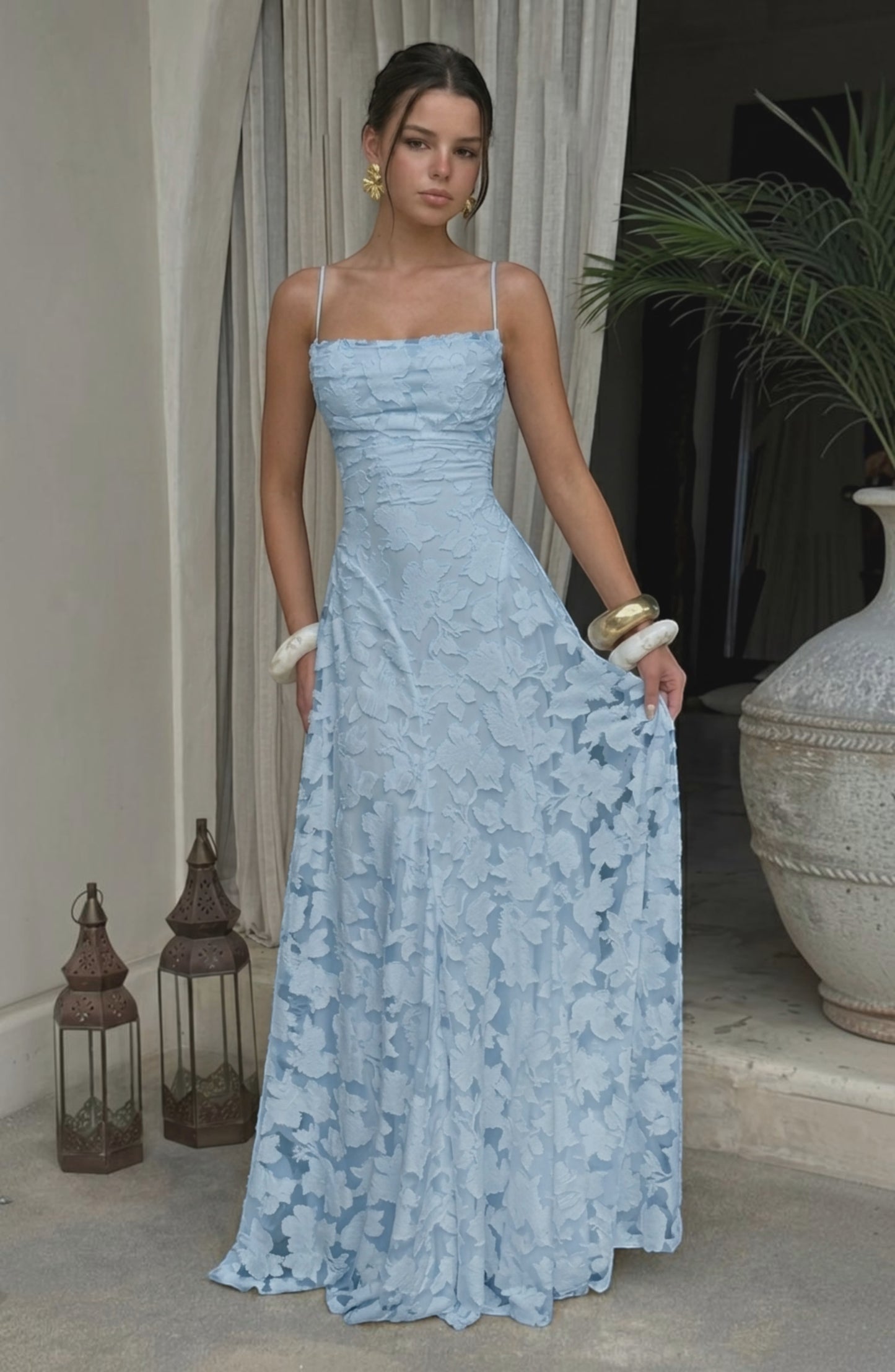 Model wearing LORVENES sexy flowy bridal dress in soft fabric with elegant design and delicate details.