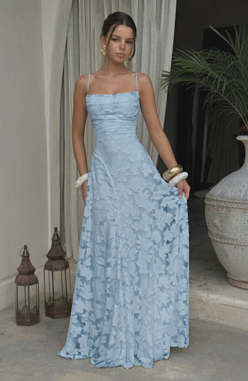 Model wearing LORVENES sexy flowy bridal dress in soft fabric with elegant design and delicate details.