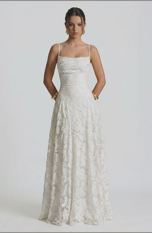 LORVENES sexy flowy bridal dress on model, featuring elegant fabric and a graceful silhouette for weddings.