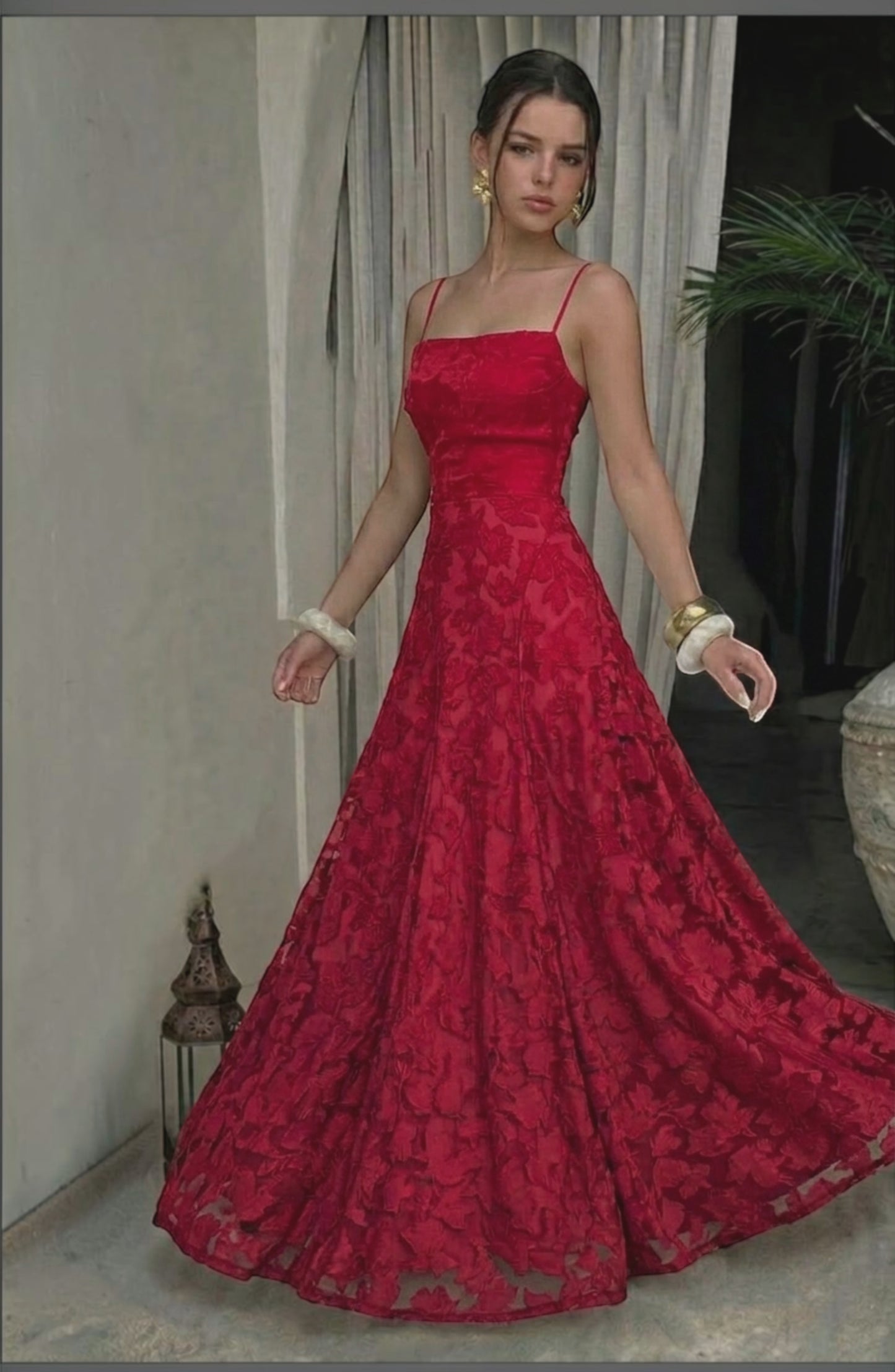 Model wearing a sexy, flowy bridal dress by LORVENES with delicate fabric and elegant design, perfect for wedding occasions.