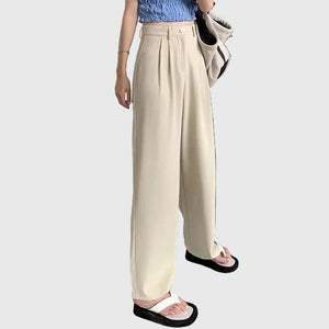 LORVENE Signature Grace pants in neutral fabric, featuring a relaxed fit and stylish design, shown on a model.