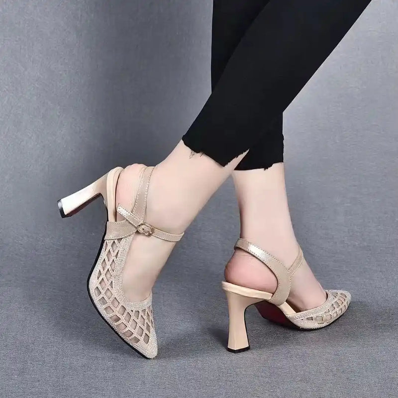 LORVENE Femme Aura heels with sleek black leather, pointed toe, and stiletto heel, displayed on a white background.
