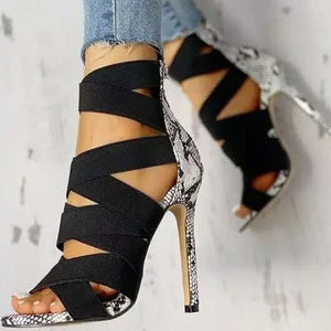 LORVENE Crystal Curve Heels featuring elegant transparent straps and sparkling crystal embellishments on a sleek stiletto sole