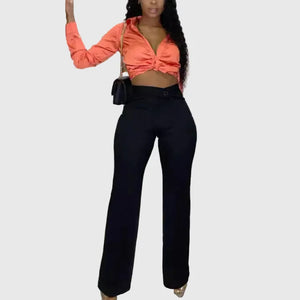 LORVENE Form Luxe Pants in sleek black fabric, featuring tailored fit and stylish design, shown on a model.