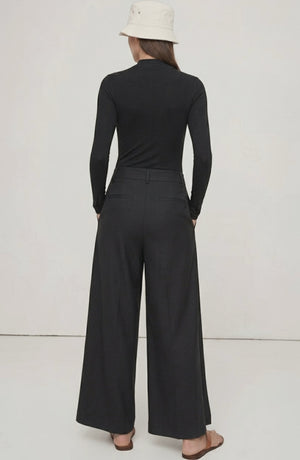 LORVENE Curve Form Pants in a top-right pose, showcasing fitted high-waisted design and stylish tailoring.