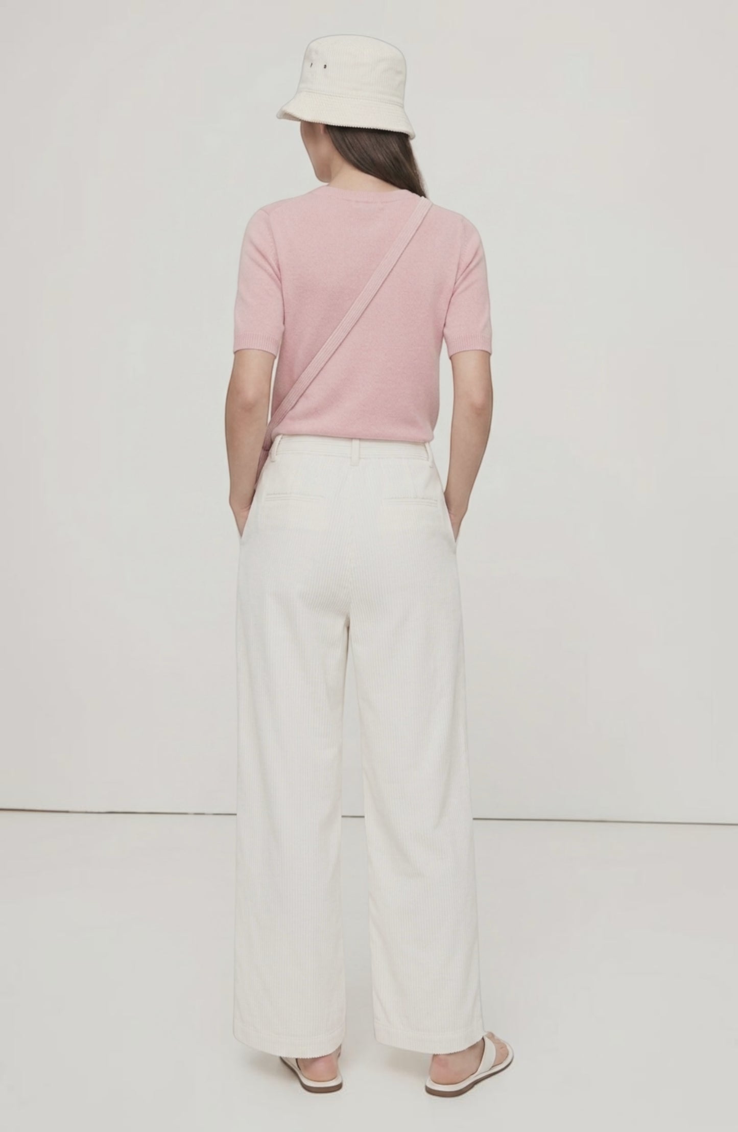 LORVENE Sleek Ease Pants shown from a top-right angle, highlighting the modern fit and smooth fabric in a stylish pose.