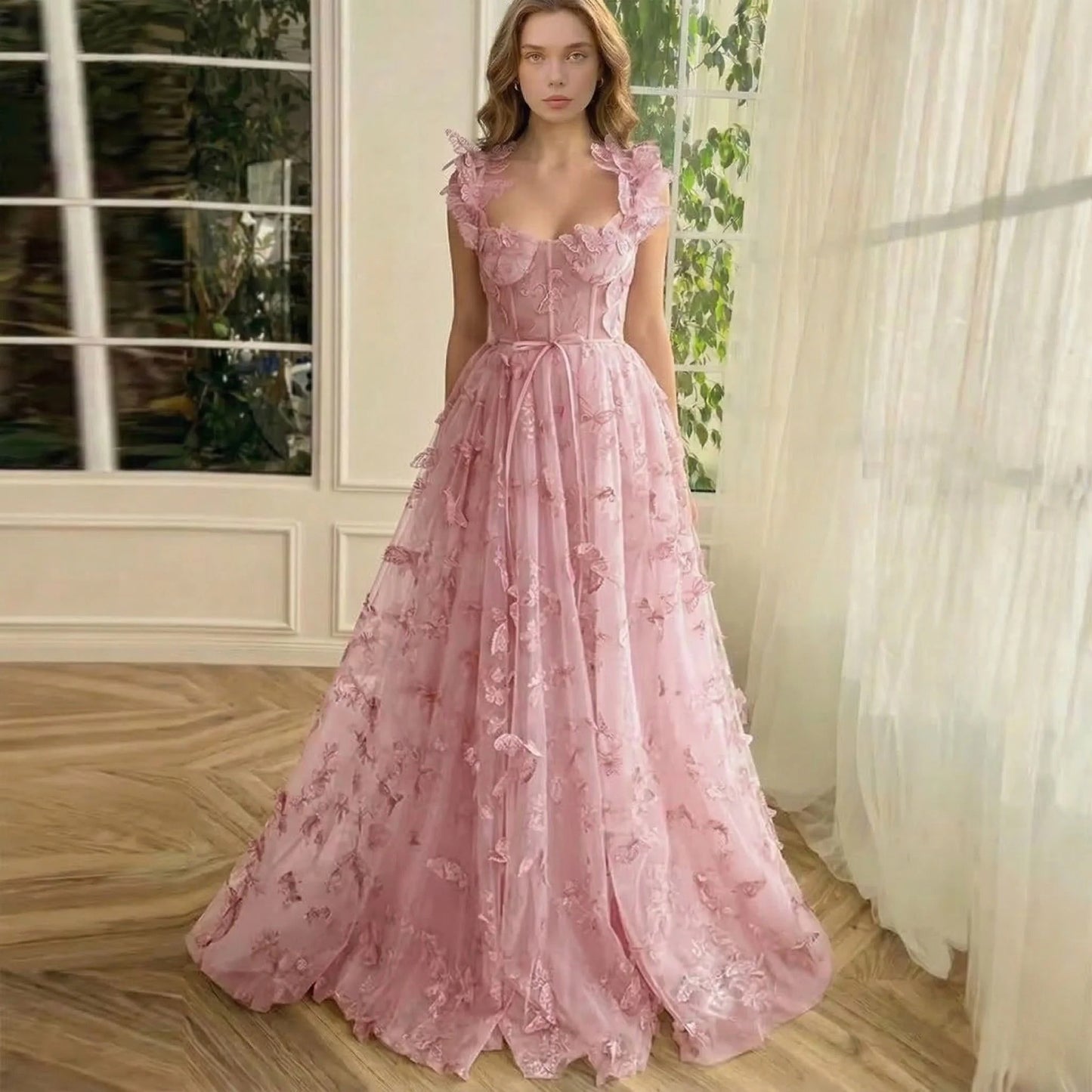 Elegant sleeveless maxi dress by LORVENES featuring a flowing fabric and a fitted waist, perfect for formal occasions.