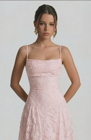 LORVENES sexy flowy bridal dress in soft pastel color with elegant draping and delicate fabric, perfect for a romantic wedding look.