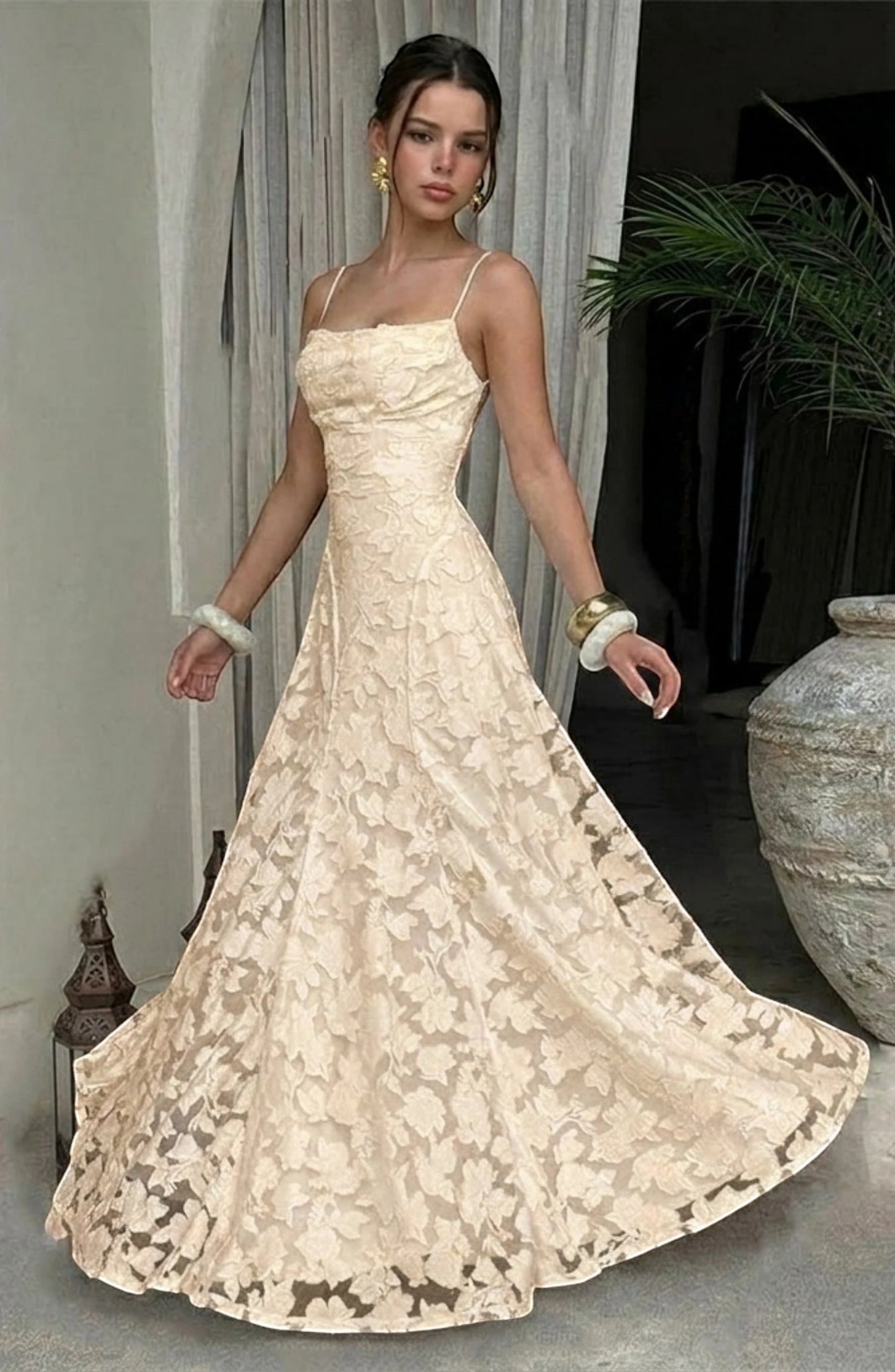 LORVENES sexy flowy bridal dress with elegant fabric and intricate details, perfect for a romantic wedding look.