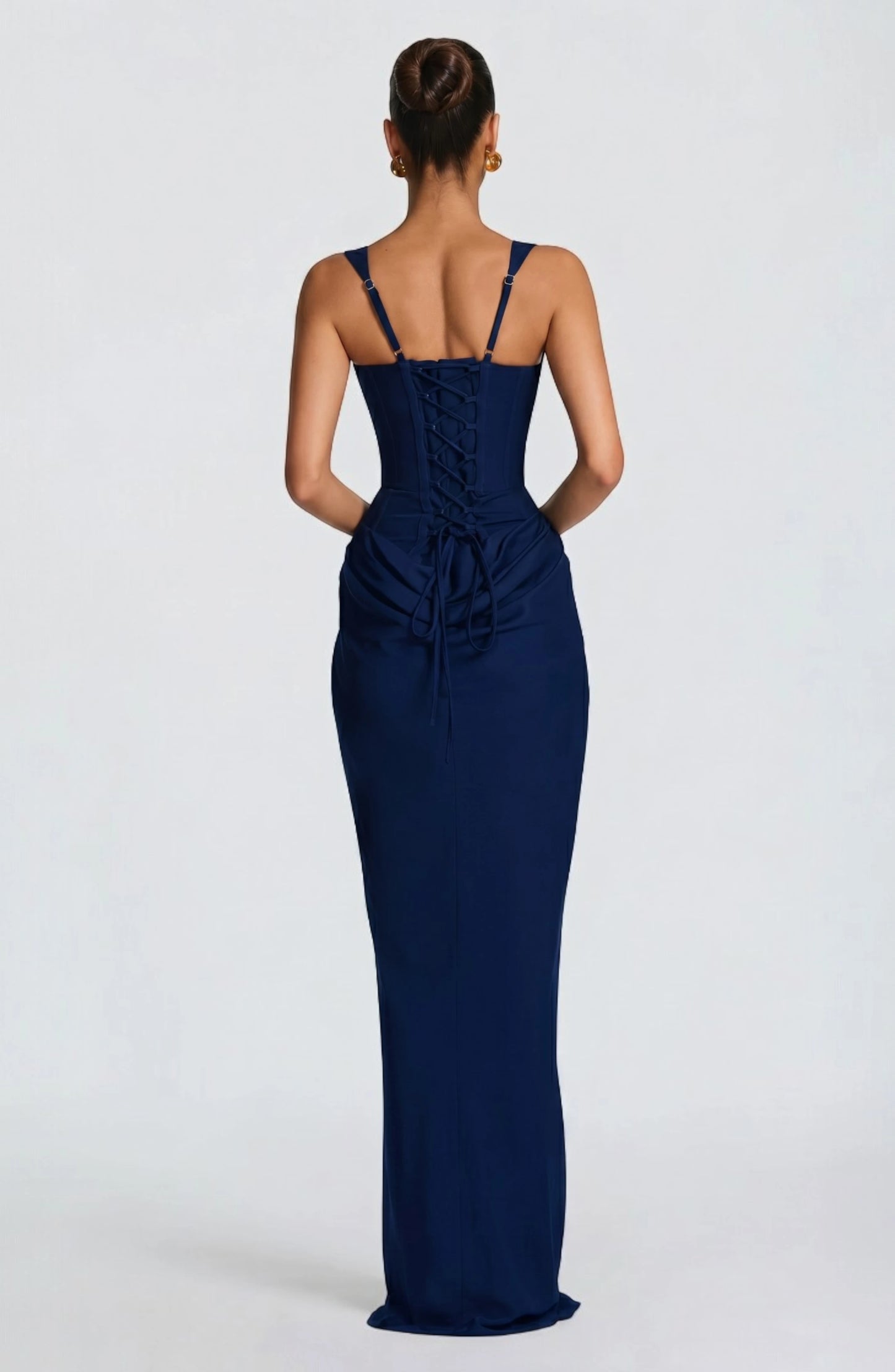 LORVENES halter bodycon maxi dress in vibrant color, fitted silhouette, with plunging neckline and flowing hem, worn by a model.