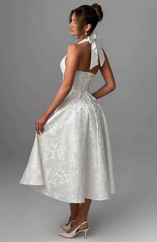 LORVENE Modern Flow Maxi dress in ivory with a flowing silhouette, displayed on a mannequin, styled for elegant occasions.
