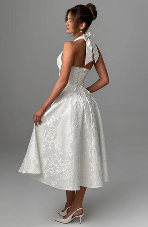 LORVENE Modern Flow Maxi dress in ivory with a flowing silhouette, displayed on a mannequin, styled for elegant occasions.