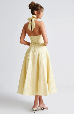 LORVENE Modern Flow Maxi dress in lemon yellow, featuring a flowing midi silhouette and stylish design, on a model.