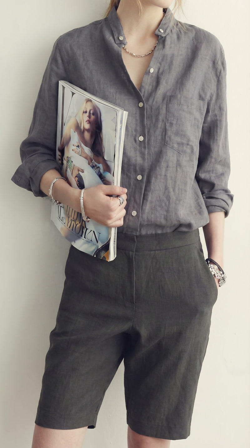 LORVENE classic button-up shirt in light blue with a collar and long sleeves, displayed on a hanger.