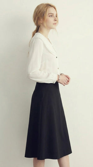LORVENE Chic Collar Shirt with button-up front, soft fabric, and stylish collar detail, shown in a close-up of the lower left section.