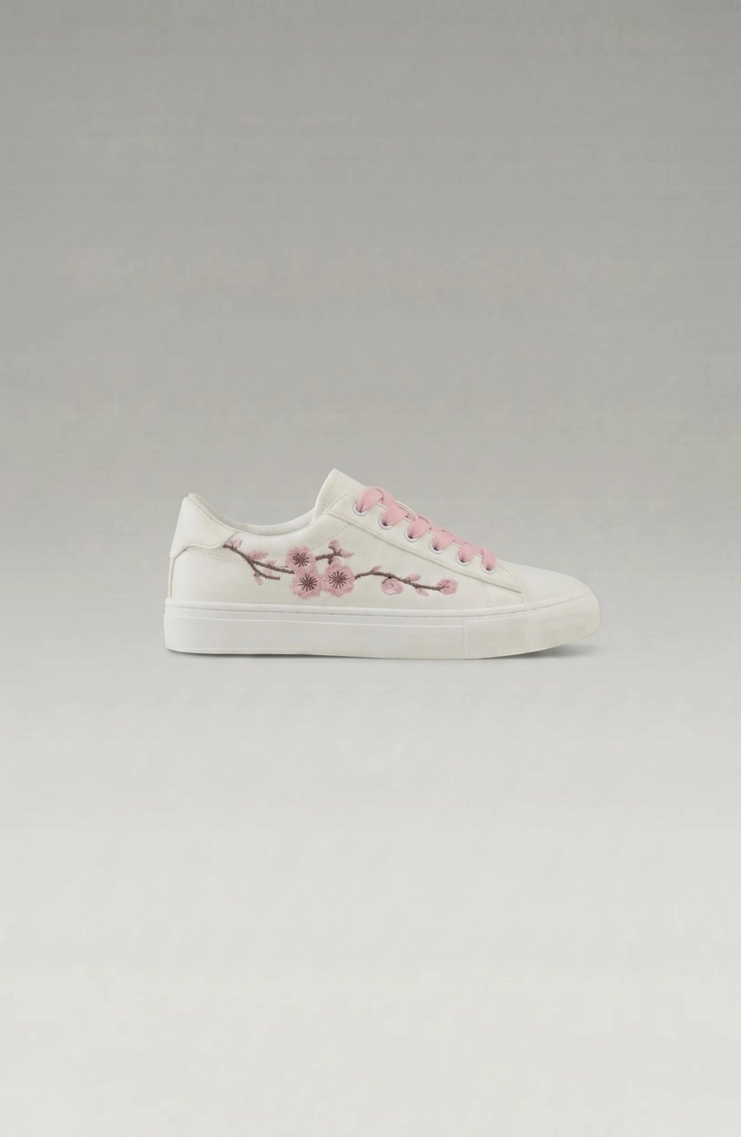 LORVENE Crystal Tone sneakers with clear crystal accents and white rubber soles, stylish casual footwear for everyday wear.