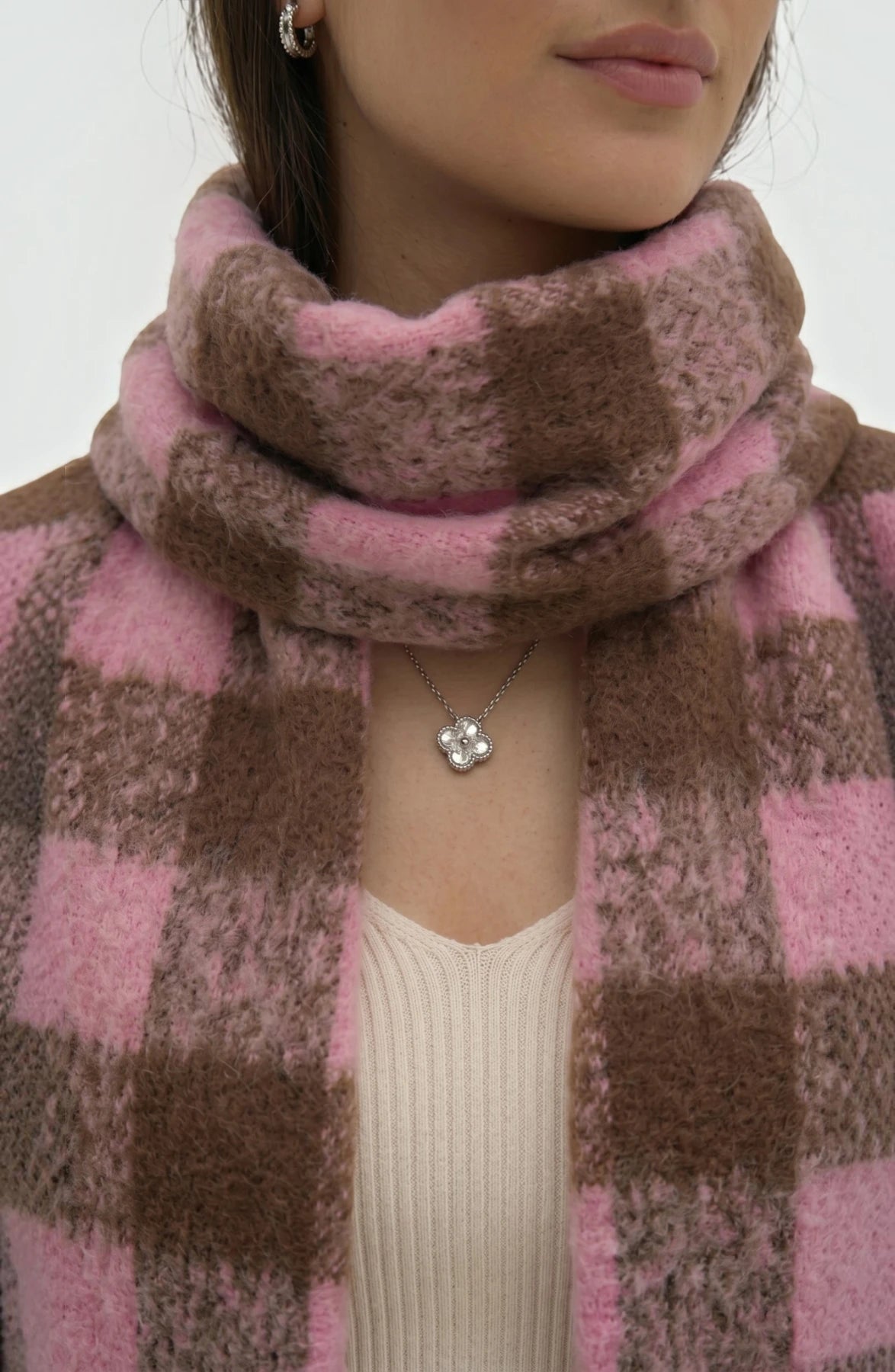 LORVENE lightweight evening shawl draped over a chair, showcasing soft fabric and elegant design for formal occasions.