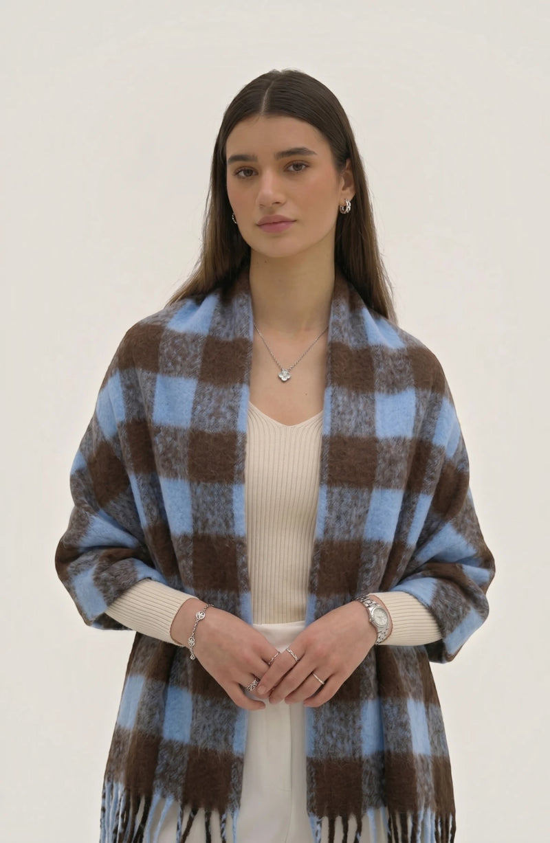 LORVENE lightweight evening shawl draped over a mannequin, showcasing soft fabric and elegant design for formal occasions.