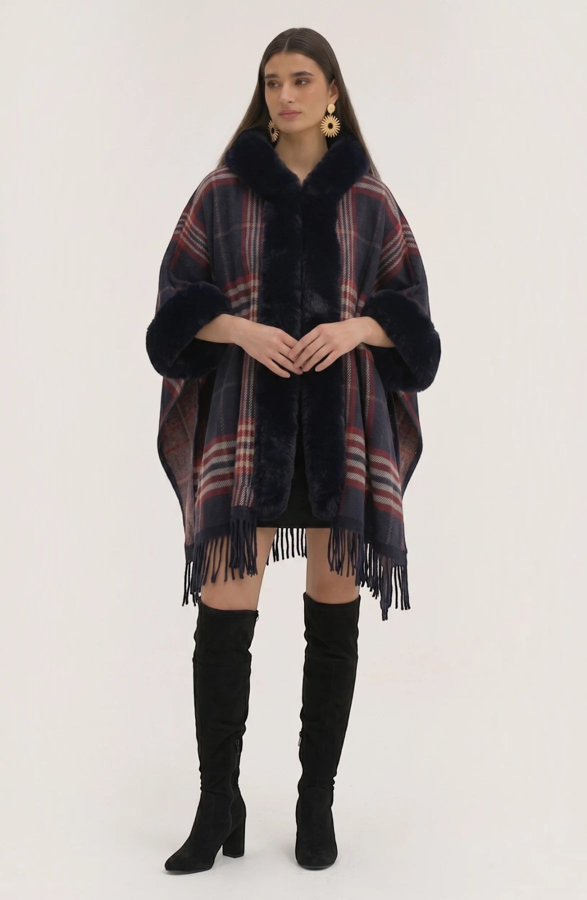LORVENE Heritage Cashmere Shawl draped over a chair, showcasing soft beige fabric with elegant fringed edges.