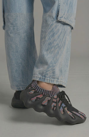 LORVENES Midnight Muse sneakers with black and gray design, featuring lace-up style and sleek athletic look.