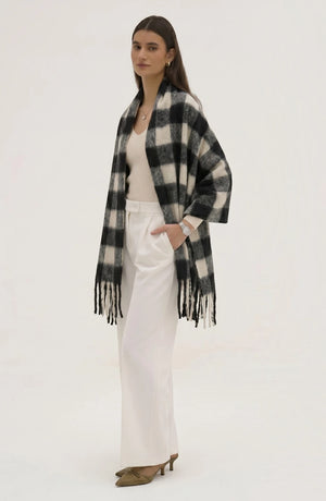 LORVENE lightweight evening shawl draped over a mannequin, showcasing soft fabric and elegant design for formal occasions.