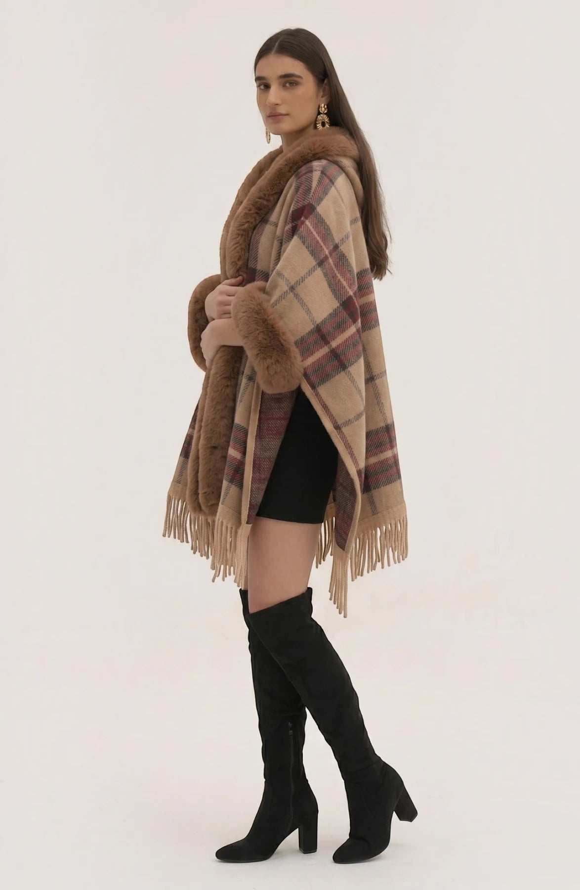 LORVENE Heritage Cashmere Shawl draped over a chair, showcasing soft beige fabric with intricate fringe detailing.