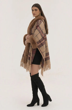 LORVENE Heritage Cashmere Shawl draped over a chair, showcasing soft beige fabric with intricate fringe detailing.