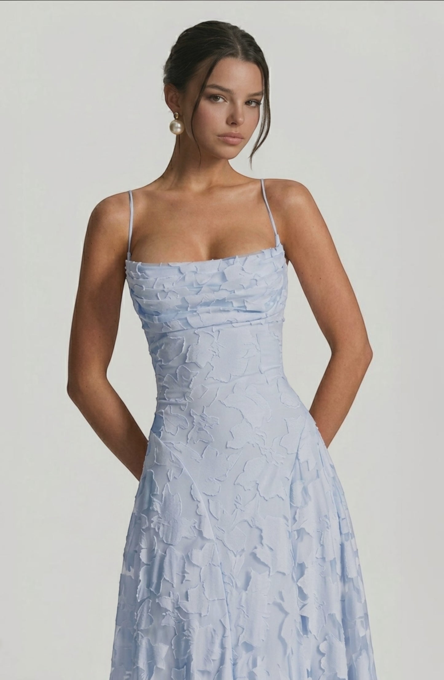 LORVENES sexy flowy bridal dress with ruffled details and elegant fabric, shown from the bottom right angle.