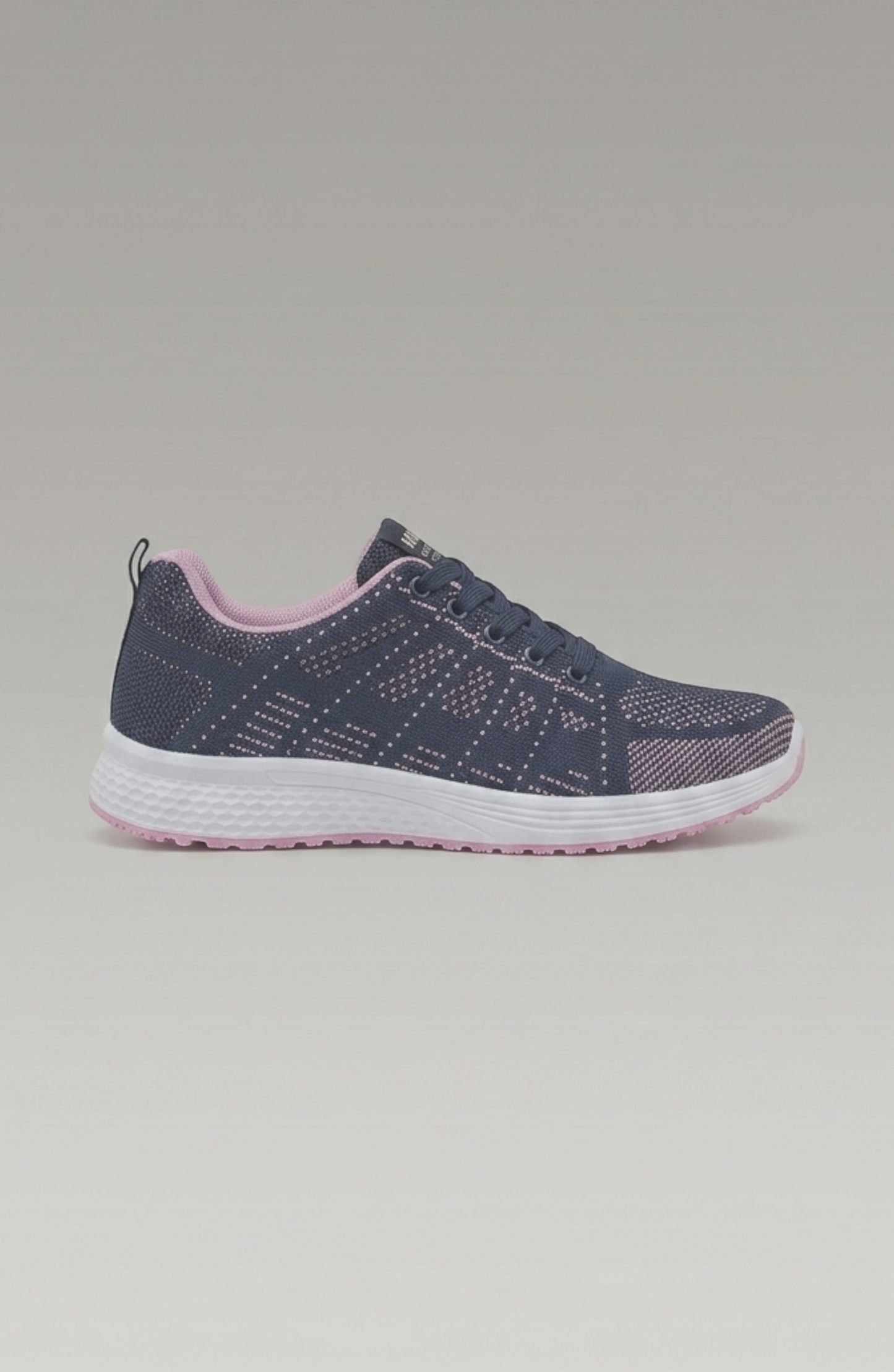 LORVENE Pure Storm sneakers in white with black accents, shown from the bottom left pose, highlighting the sole and side details.