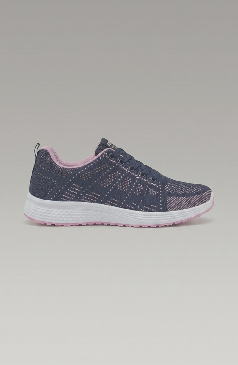 LORVENE Pure Storm sneakers in white with black accents, shown from the bottom left pose, highlighting the sole and side details.