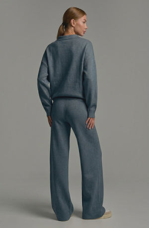 LORVENES knit trouser set worn by a model, featuring a cozy, stylish matching top and wide-leg knit trousers.